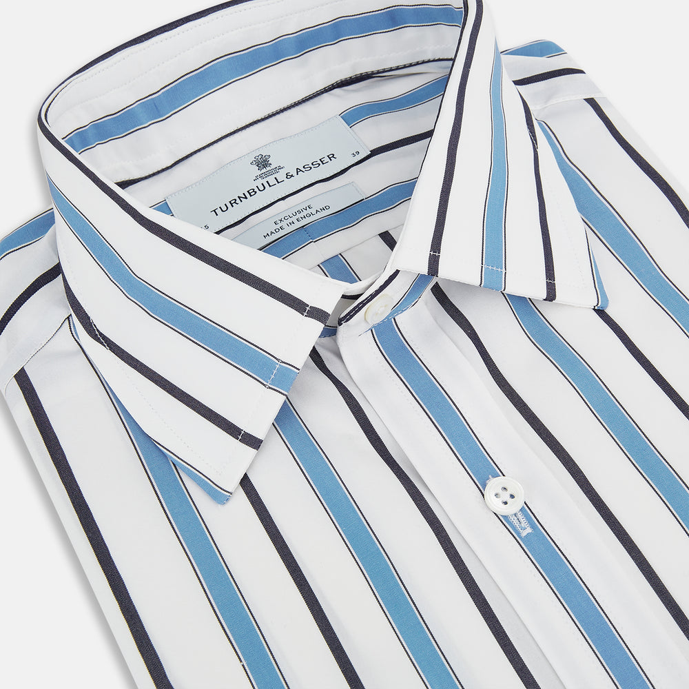 The Sky Blue Multi Candy Stripe Mayfair Shirt by Turnbull & Asser features vertical blue, black, and white stripes, a pointed collar, matching cuffs, and showcases signature British craftsmanship.