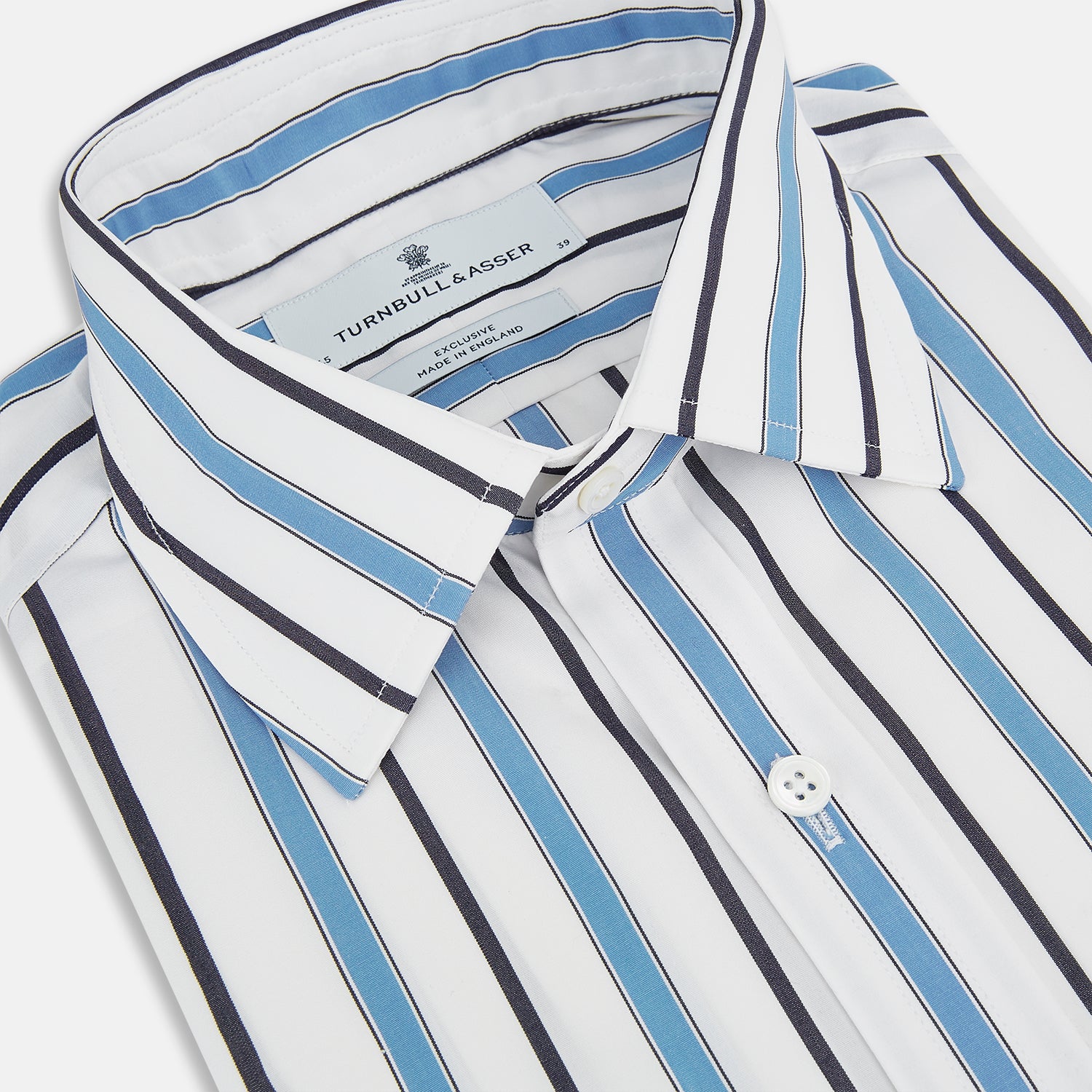 View 2 of product The Sky Blue Multi Candy Stripe Mayfair Shirt by Turnbull & Asser features vertical blue, black, and white stripes, a pointed collar, matching cuffs, and showcases signature British craftsmanship.