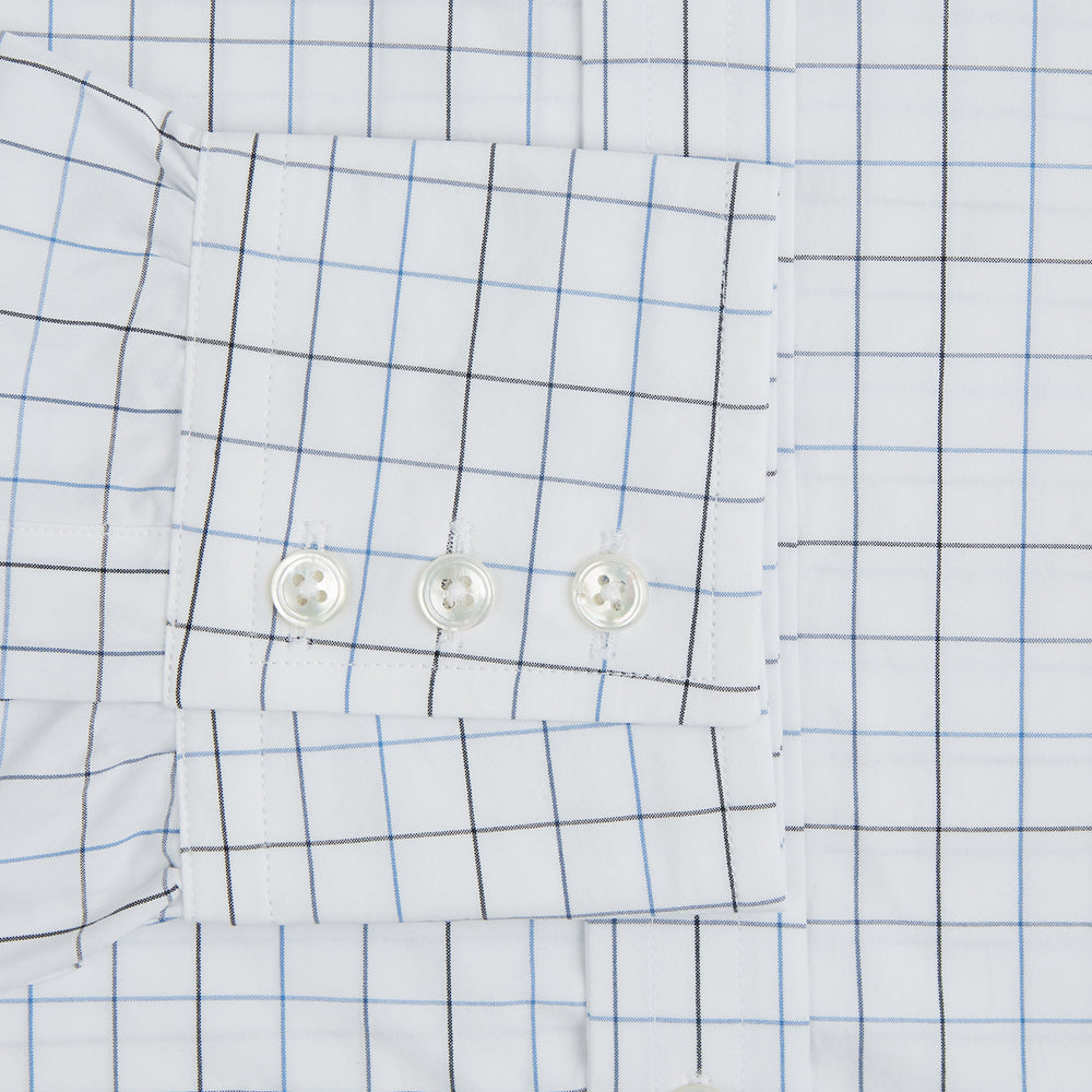 The Blue Grid Check Mayfair Shirt by Turnbull & Asser is a long-sleeve, button-up shirt with a T&A collar, crafted from organic cotton in a light and dark blue grid pattern, shown flat against a white background.