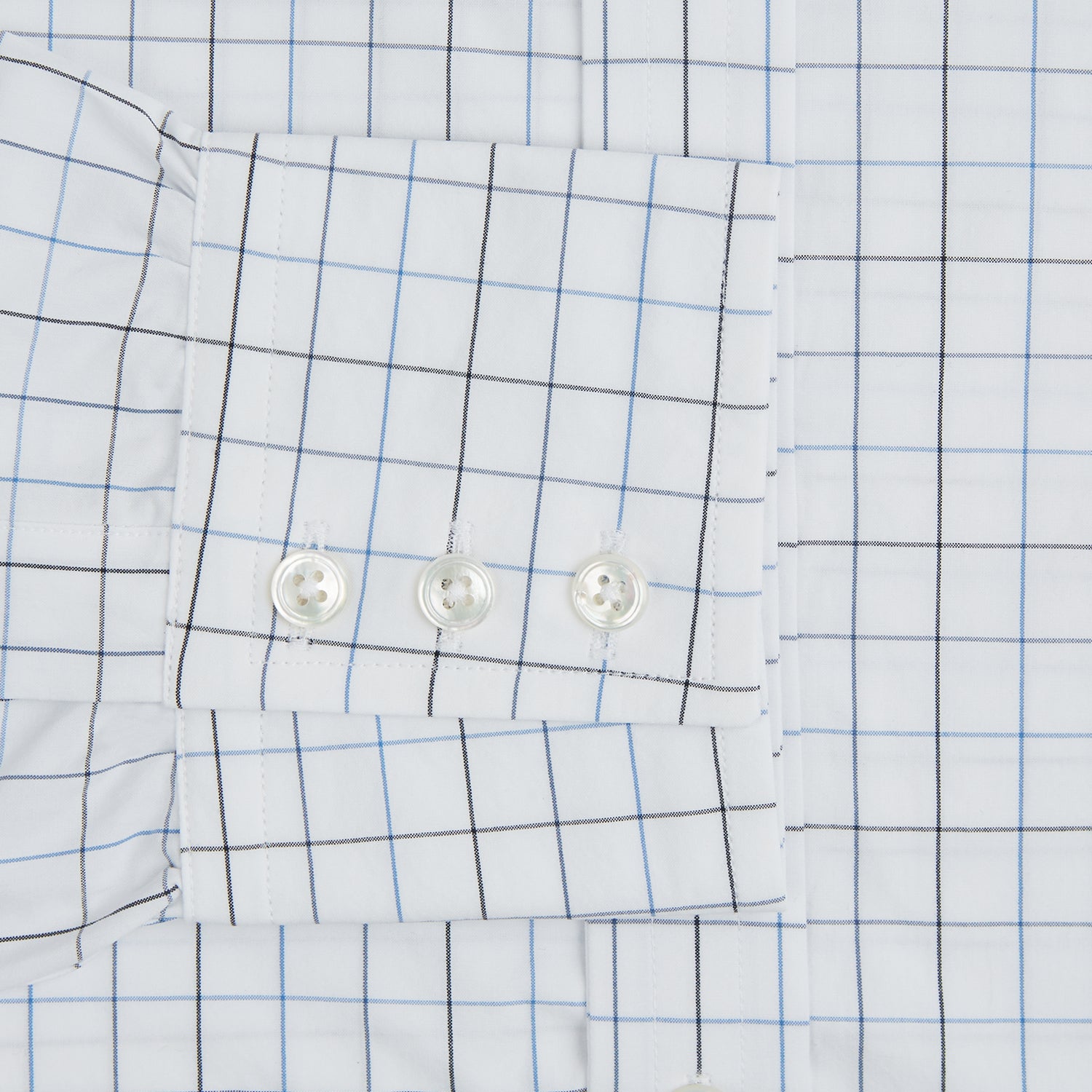 View 4 of product The Blue Grid Check Mayfair Shirt by Turnbull & Asser is a long-sleeve, button-up shirt with a T&A collar, crafted from organic cotton in a light and dark blue grid pattern, shown flat against a white background.