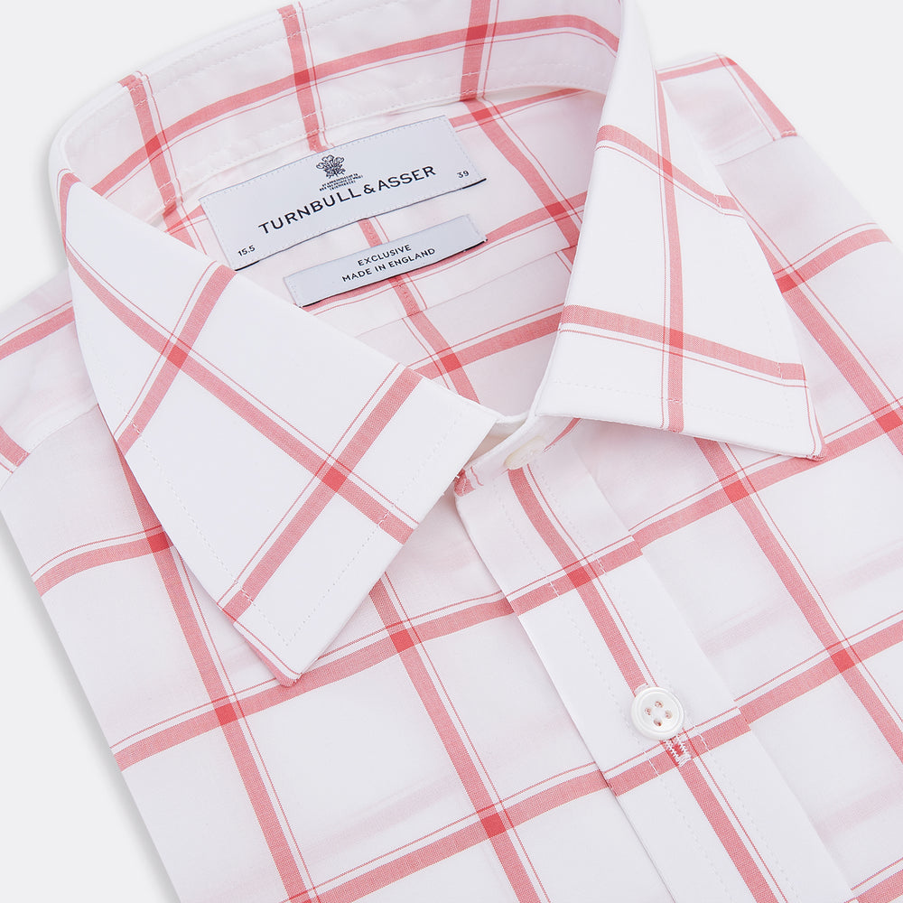 The Turnbull & Asser Coral Grid Check Mayfair Shirt is a white long-sleeve shirt with a collar, made from fine Italian cotton and featuring an evenly spaced coral grid check pattern.