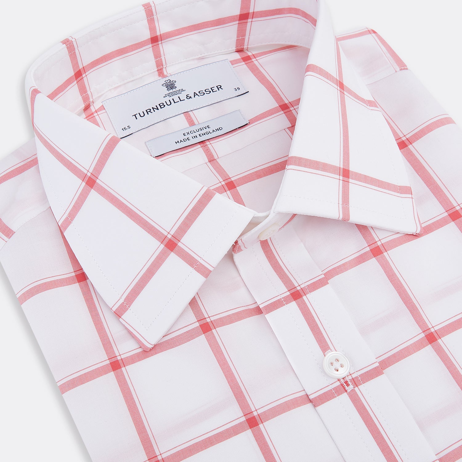 View 2 of product The Turnbull & Asser Coral Grid Check Mayfair Shirt is a white long-sleeve shirt with a collar, made from fine Italian cotton and featuring an evenly spaced coral grid check pattern.