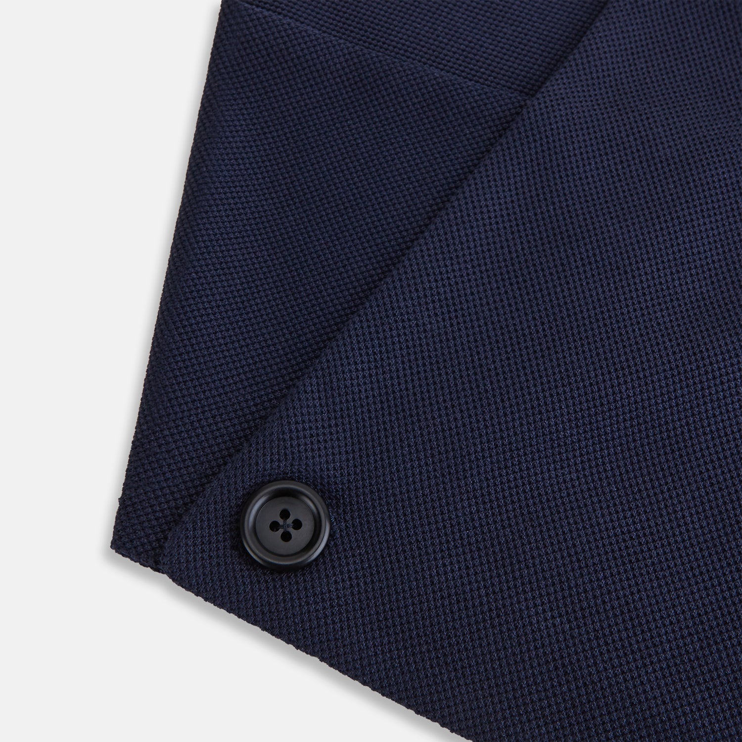 View 4 of product The Turnbull & Asser Navy Silk and Cotton Neck Warmer features a dark navy blue textured fabric and a single black button, shown against a plain light gray background.