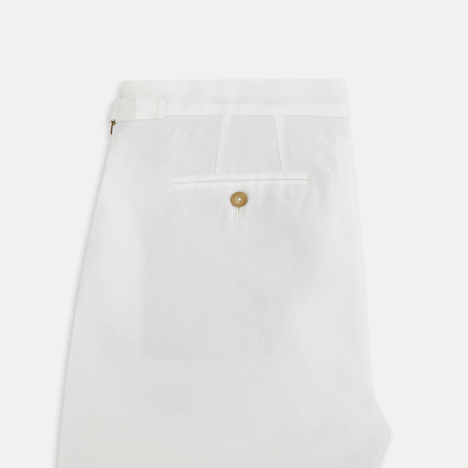 View 5 of product Turnbull & Asser White Linen Henry Trousers, featuring a straight-leg cut with front button and zip closure, are displayed against a plain white background.