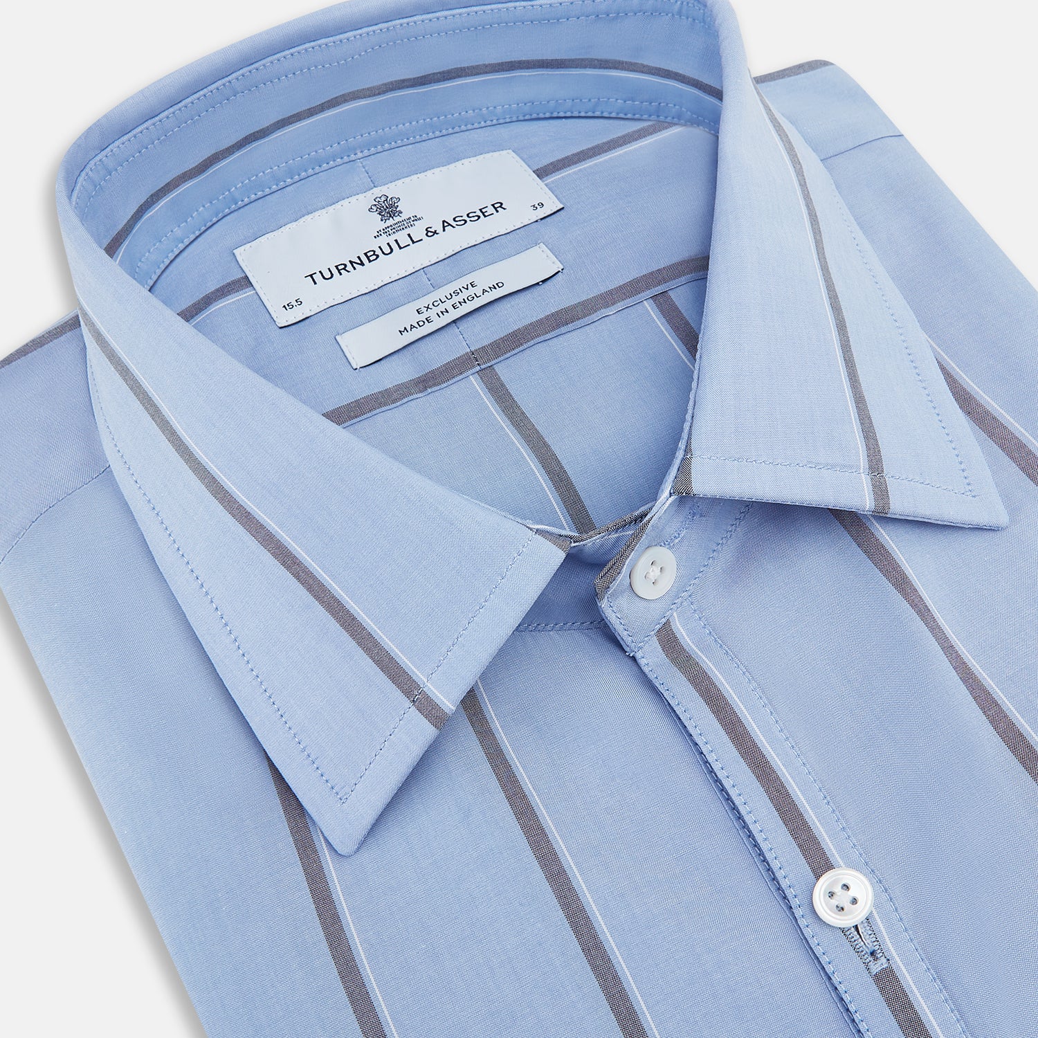 View 2 of product The Sky Blue Track Stripe Westminster Shirt by Turnbull & Asser features long sleeves, a Turnbull collar, and vertical dark blue and white stripes, displayed flat on a white surface.