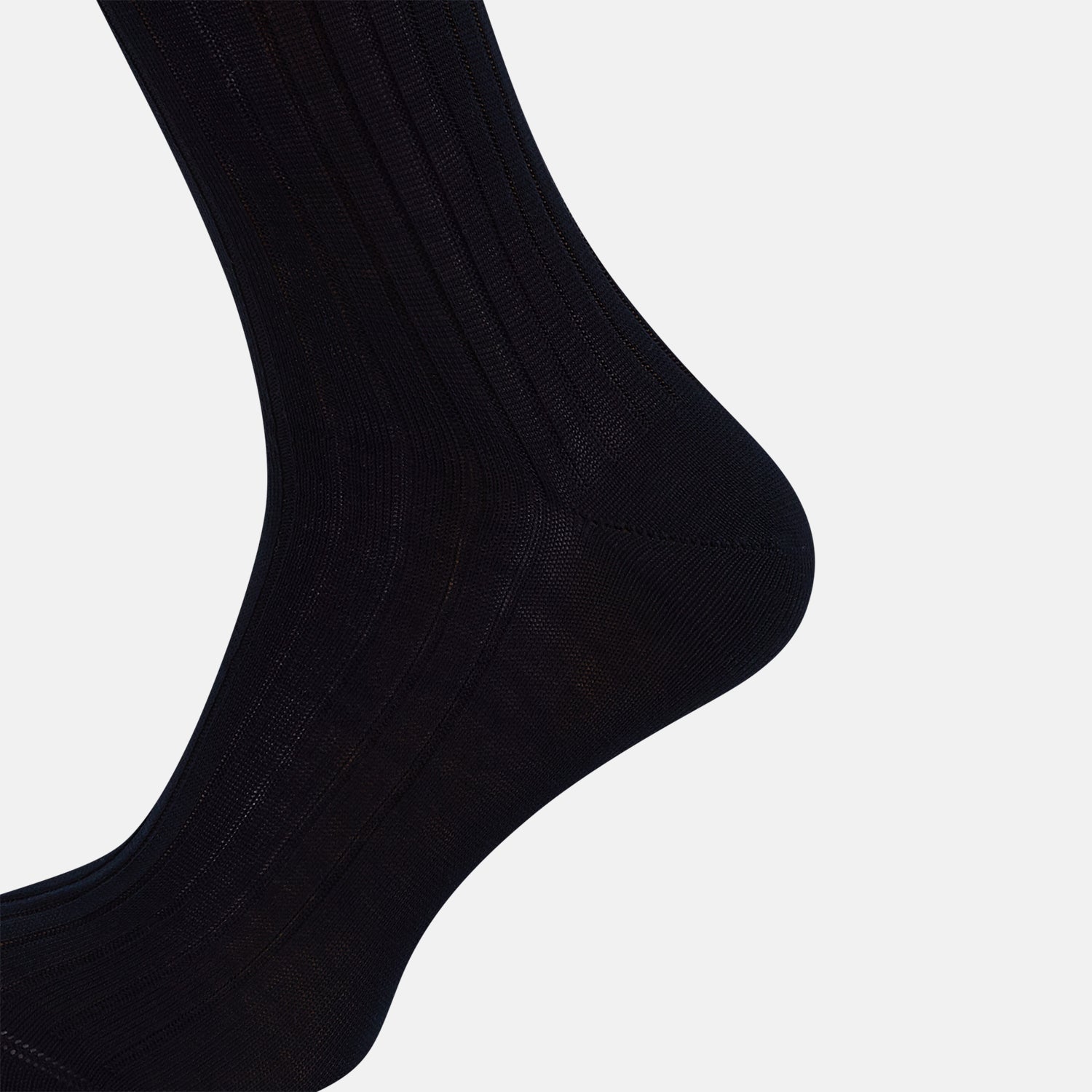 View 4 of product A single Midnight Thick Knit Mid-Length Sock by Turnbull & Asser, crafted from black mercerised Egyptian cotton, is shown in side profile against a plain white background with the toe pointing left.