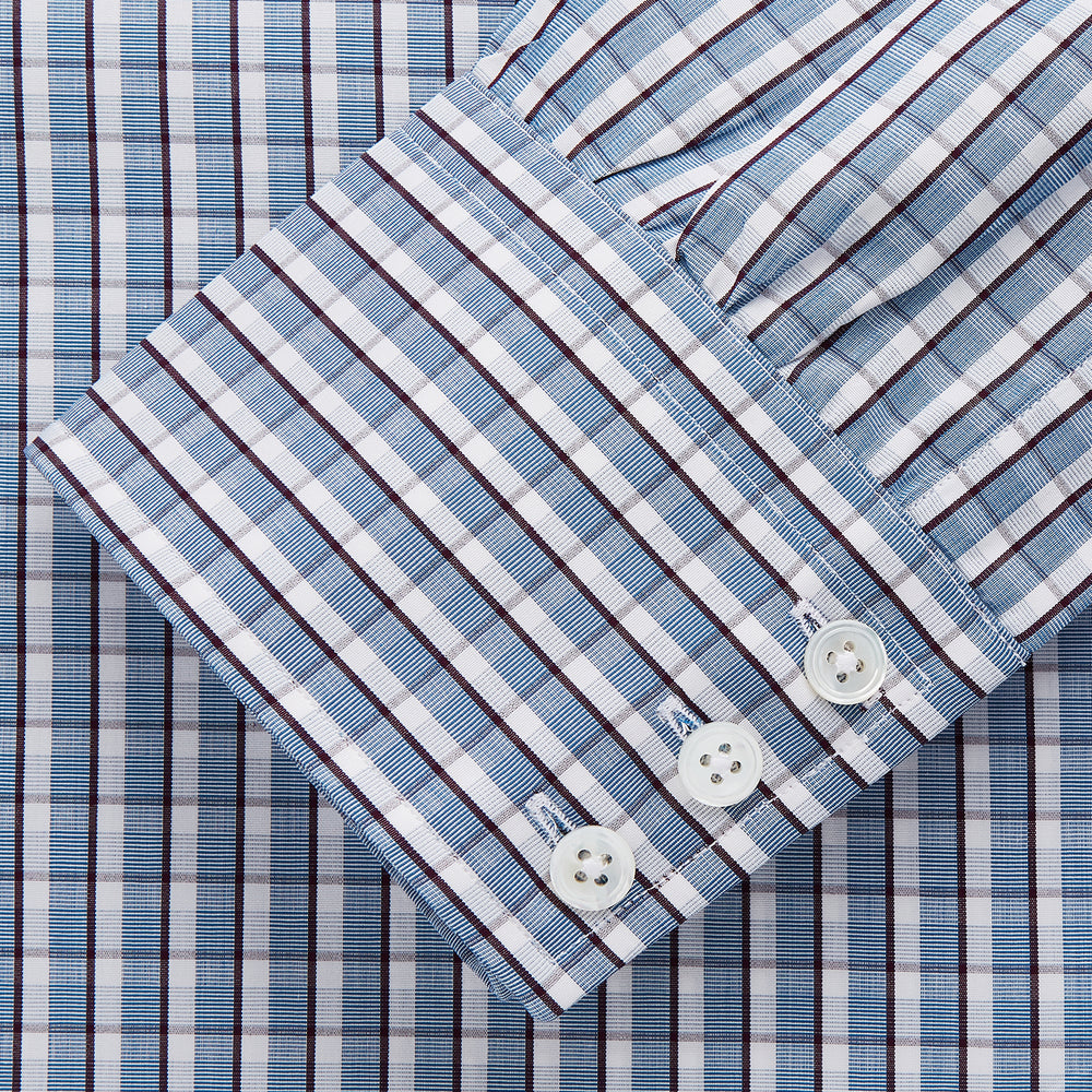 The Turnbull & Asser Blue and White Check Cotton Regular Fit Mayfair Shirt features long sleeves, a pointed collar, and buttoned cuffs, shown here on a white background.