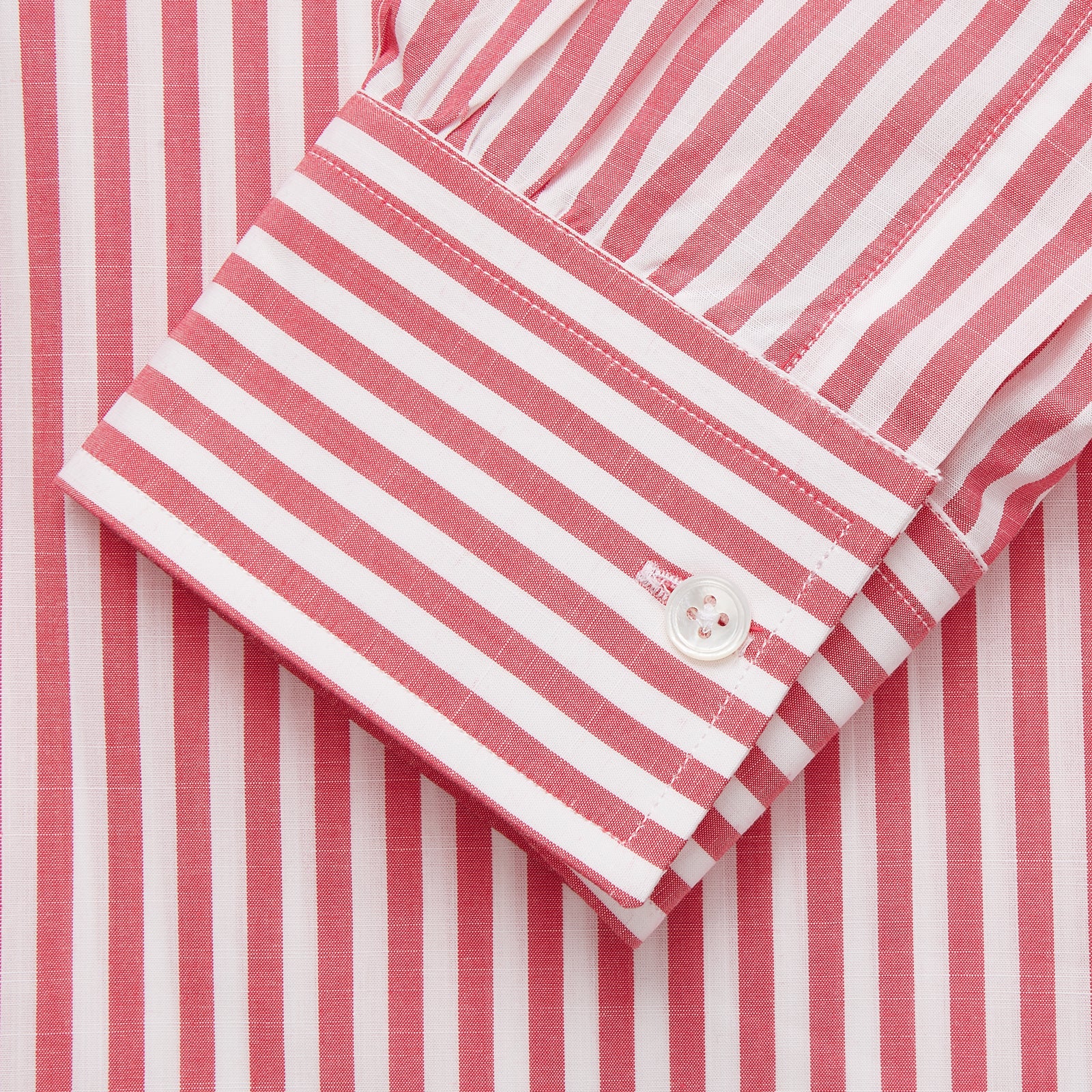 View 3 of product The Pink Candy Stripe Cotton Weekend Fit Finch Shirt by Turnbull & Asser features vertical red and white stripes, a left chest pocket, and a classic collar—an essential men’s wardrobe staple shown against a white backdrop.