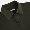 View 2 of product The Turnbull & Asser Olive Corduroy Hampstead Overshirt for men features a collar, long sleeves, left chest pocket, and two zippered side pockets, shown laid flat on a white background.