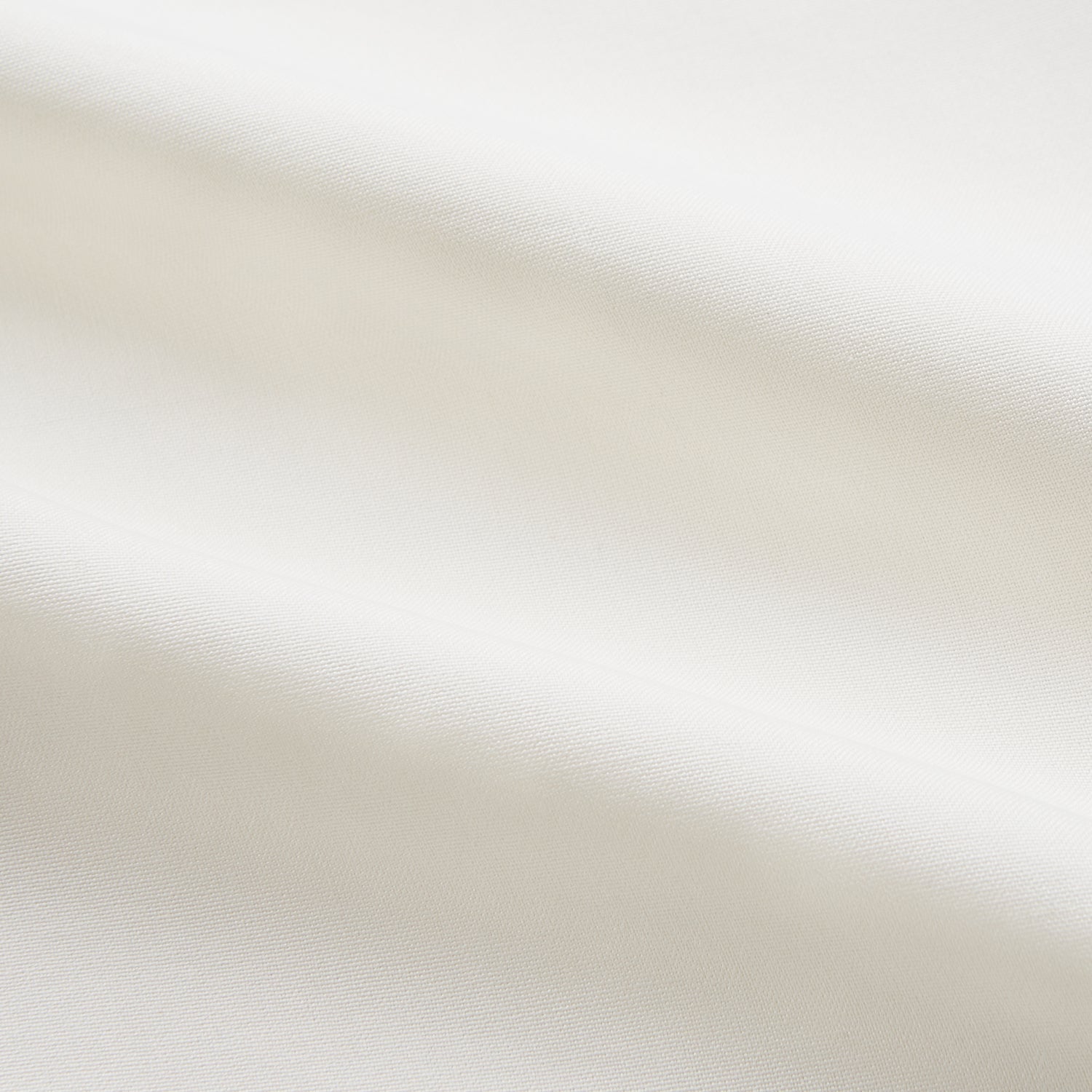 View 5 of product The Cream Silk Whitby Shirt by Turnbull & Asser features a pointed collar, buttoned front and cuffs, and long sleeves, shown in Whitby Fit and laid flat on a white background.