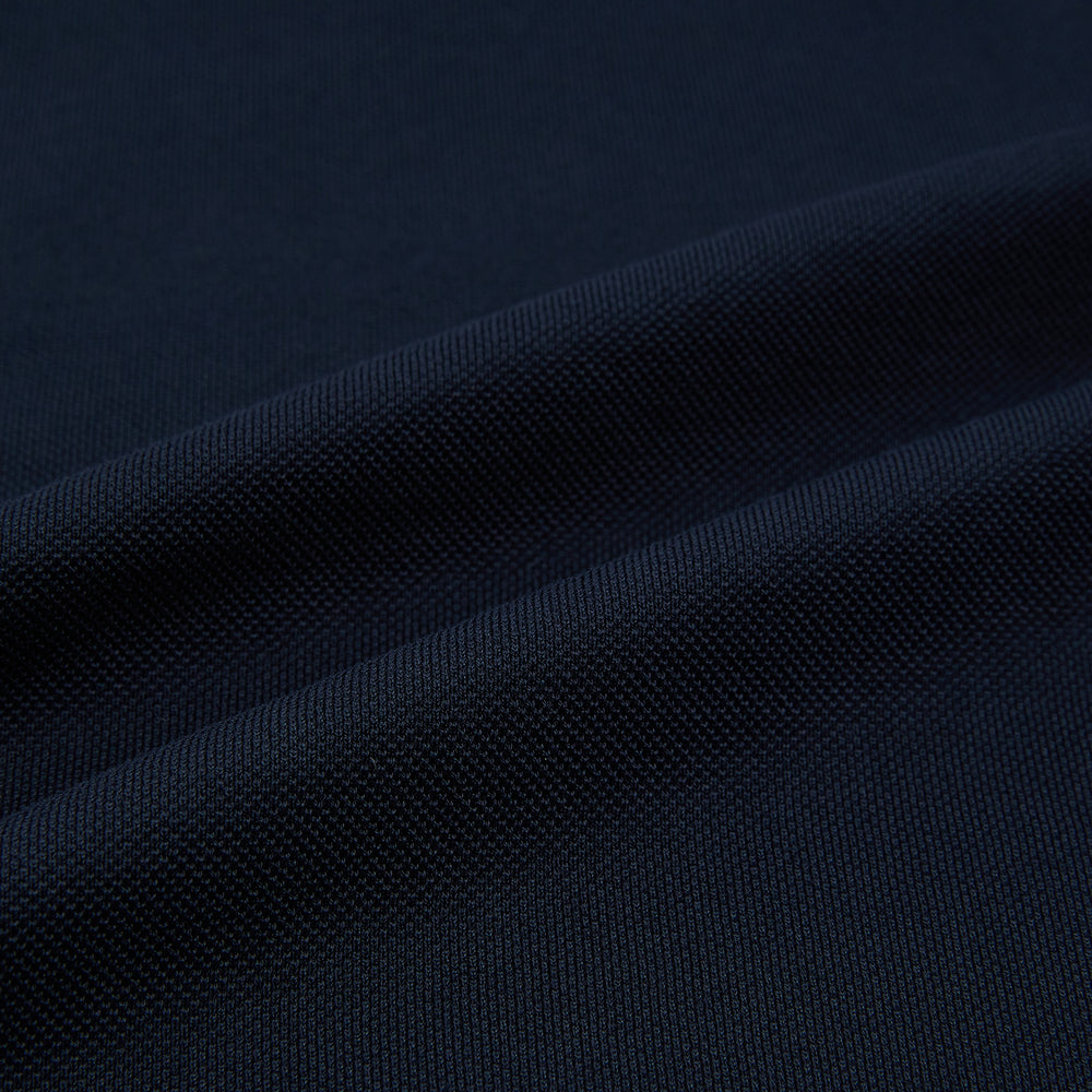The Turnbull & Asser Navy Polo Shirt features short sleeves, a collar, three-button placket, and a single buttoned chest pocket, shown flat on a plain white background.