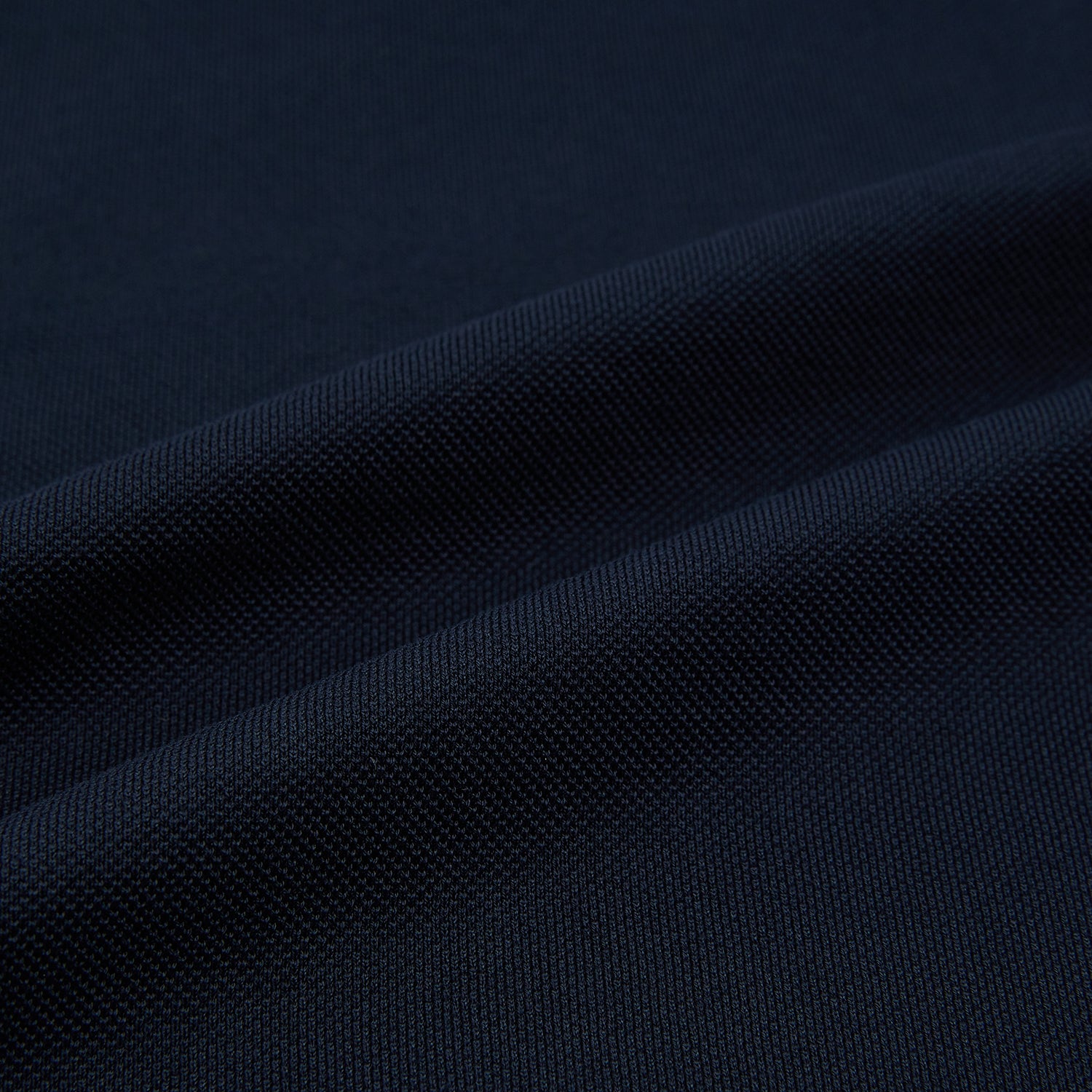 View 5 of product The Turnbull & Asser Navy Polo Shirt features short sleeves, a collar, three-button placket, and a single buttoned chest pocket, shown flat on a plain white background.