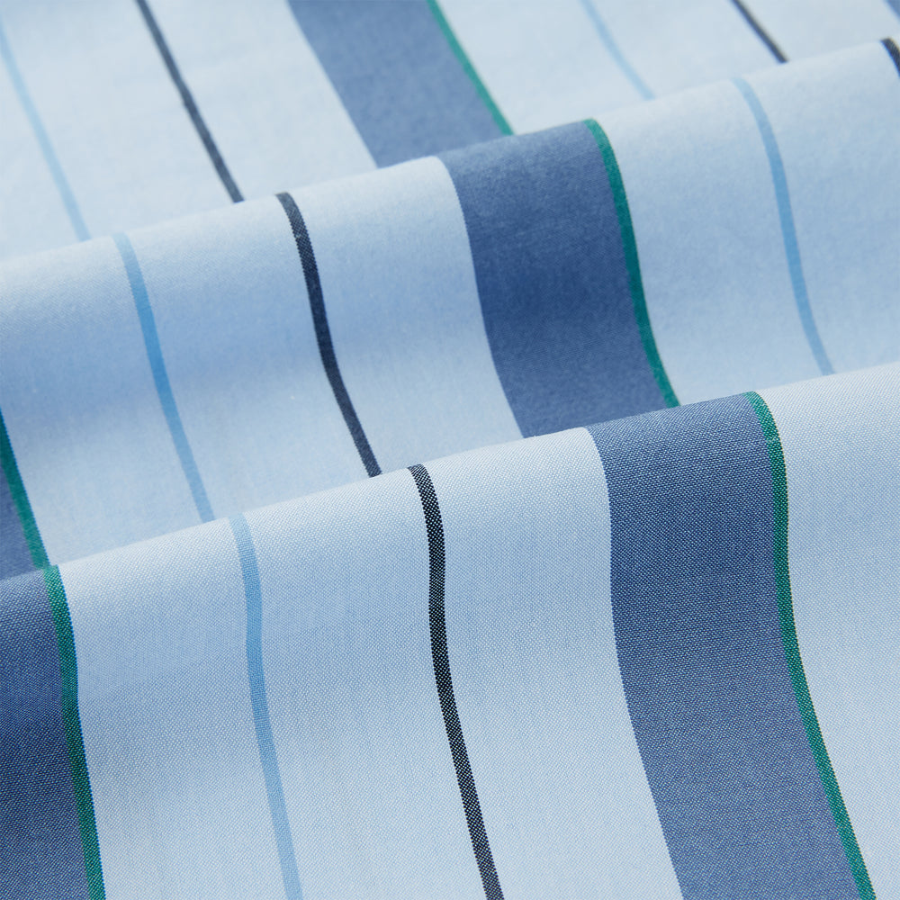 The Blue Baiadera Stripe Pyjama Shirt by Turnbull & Asser features long sleeves, a chest pocket, and a notched collar for an elegant nightwear look, shown on a white background.