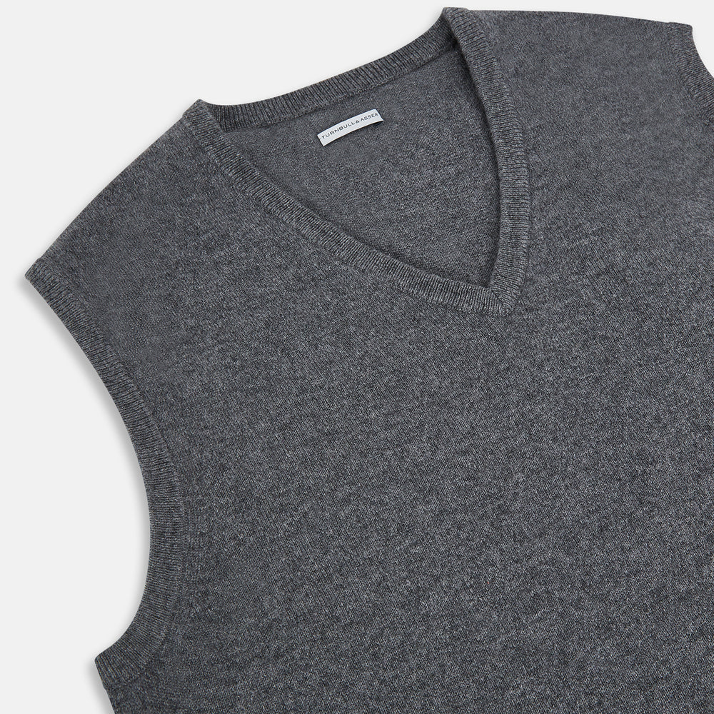 The Turnbull & Asser Slate Grey Melange V-neck Cashmere Vest is a plain, sleeveless jumper shown against a white background.
