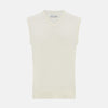 View 1 of product The Turnbull & Asser White Cashmere V-neck Vest is a sleeveless ivory knit with ribbed trim, ideal for layering in cooler weather, shown against a plain white background.