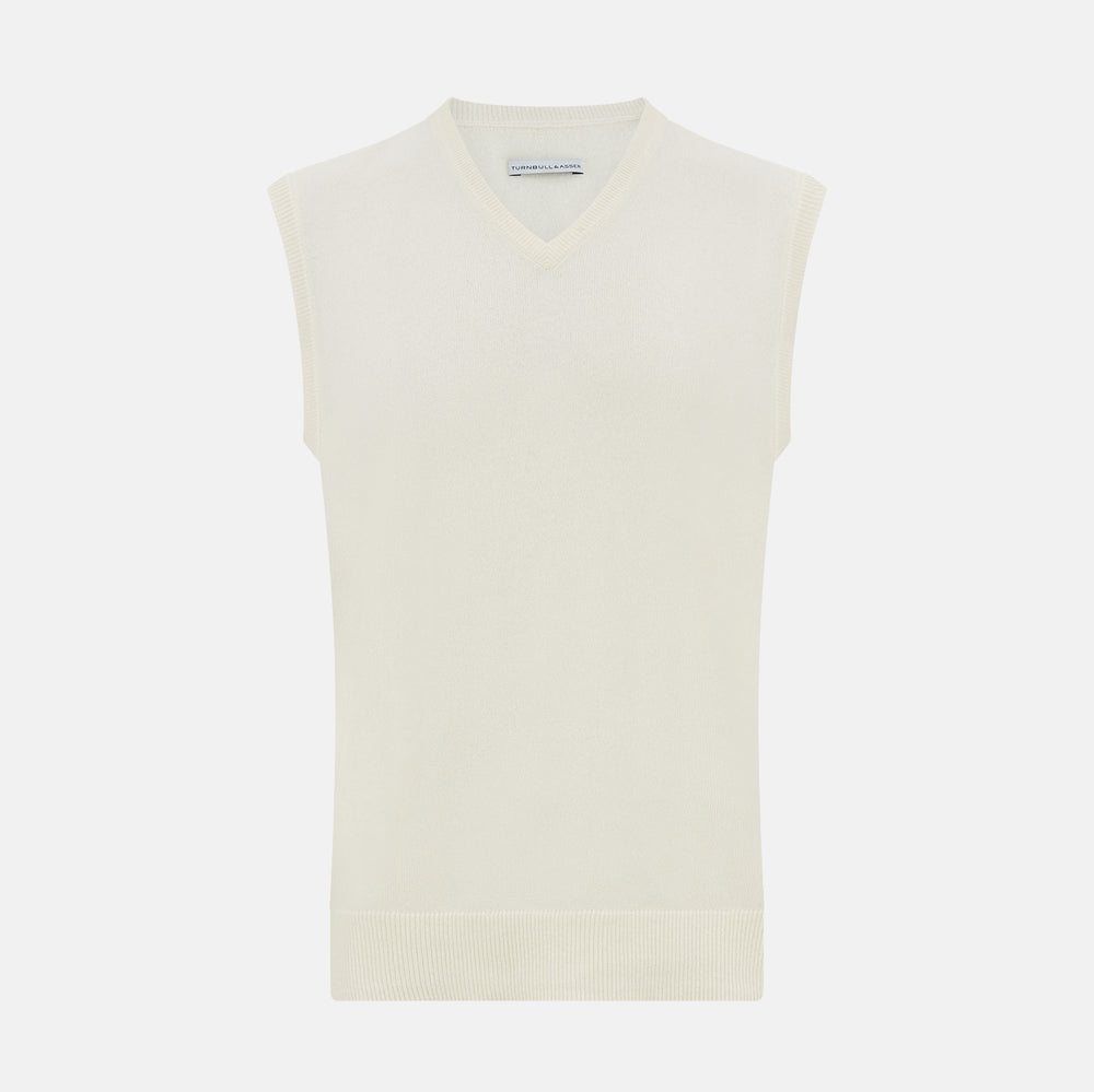 The Turnbull & Asser White Cashmere V-neck Vest is a sleeveless ivory knit with ribbed trim, ideal for layering in cooler weather, shown against a plain white background.