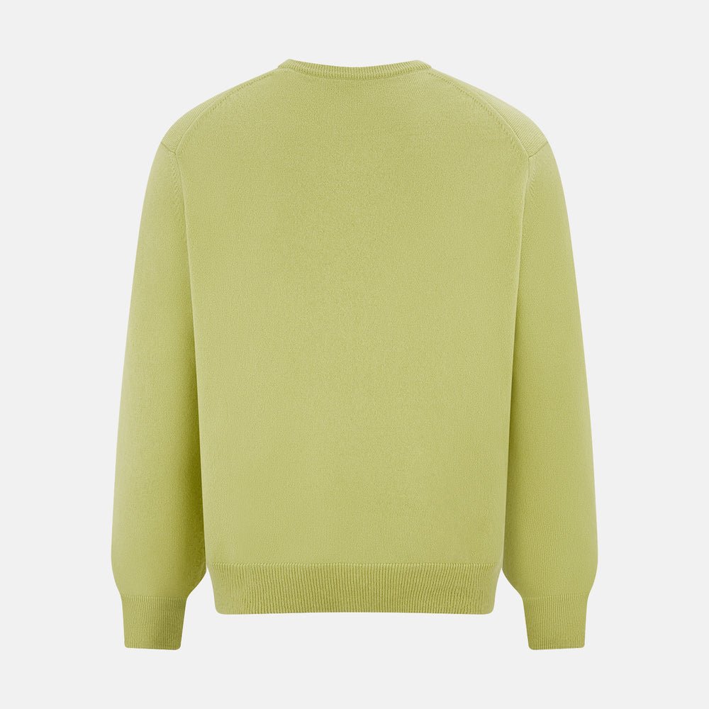 The Turnbull & Asser Melon Green Cashmere V-Neck Jumper features long sleeves with ribbed cuffs and hem, shown against a plain white background.