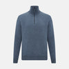 View 1 of product The Blue Melange Half-Zip Cashmere Jumper by Turnbull & Asser features a high collar, ribbed cuffs and hem, and long sleeves. This pullover sweater is shown against a plain white background.