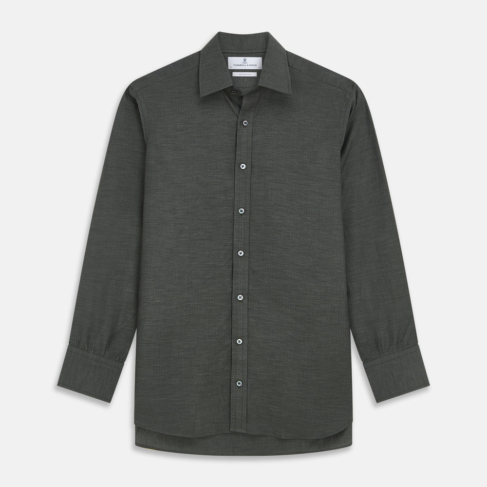 The Turnbull & Asser Dark Green Cotton Melange Regular Fit Mayfair Shirt features long sleeves, a T&A collar, buttoned cuffs, and a slightly rounded hem, shown laid flat on a white background.