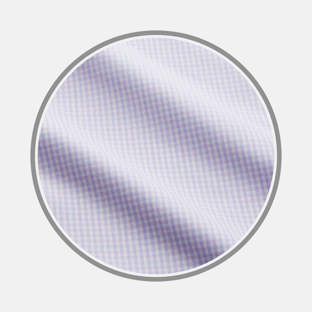 Close-up of Blue Multi Check Cashmerello Fabric by Turnbull & Asser, featuring a small blue check pattern and soft texture with gentle folds, displayed within a circular frame on a plain white background.