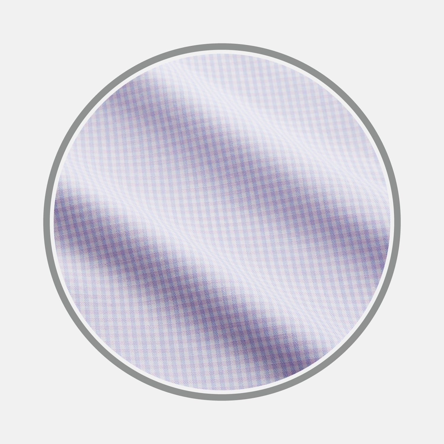 View 1 of product Close-up of Blue Multi Check Cashmerello Fabric by Turnbull & Asser, featuring a small blue check pattern and soft texture with gentle folds, displayed within a circular frame on a plain white background.