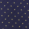 View 4 of product The Turnbull & Asser Navy Spot Woven Herringbone Silk Tie features a navy blue base with evenly spaced yellow polka dots, making it an essential accessory for smart attire. Displayed rolled on a white background.