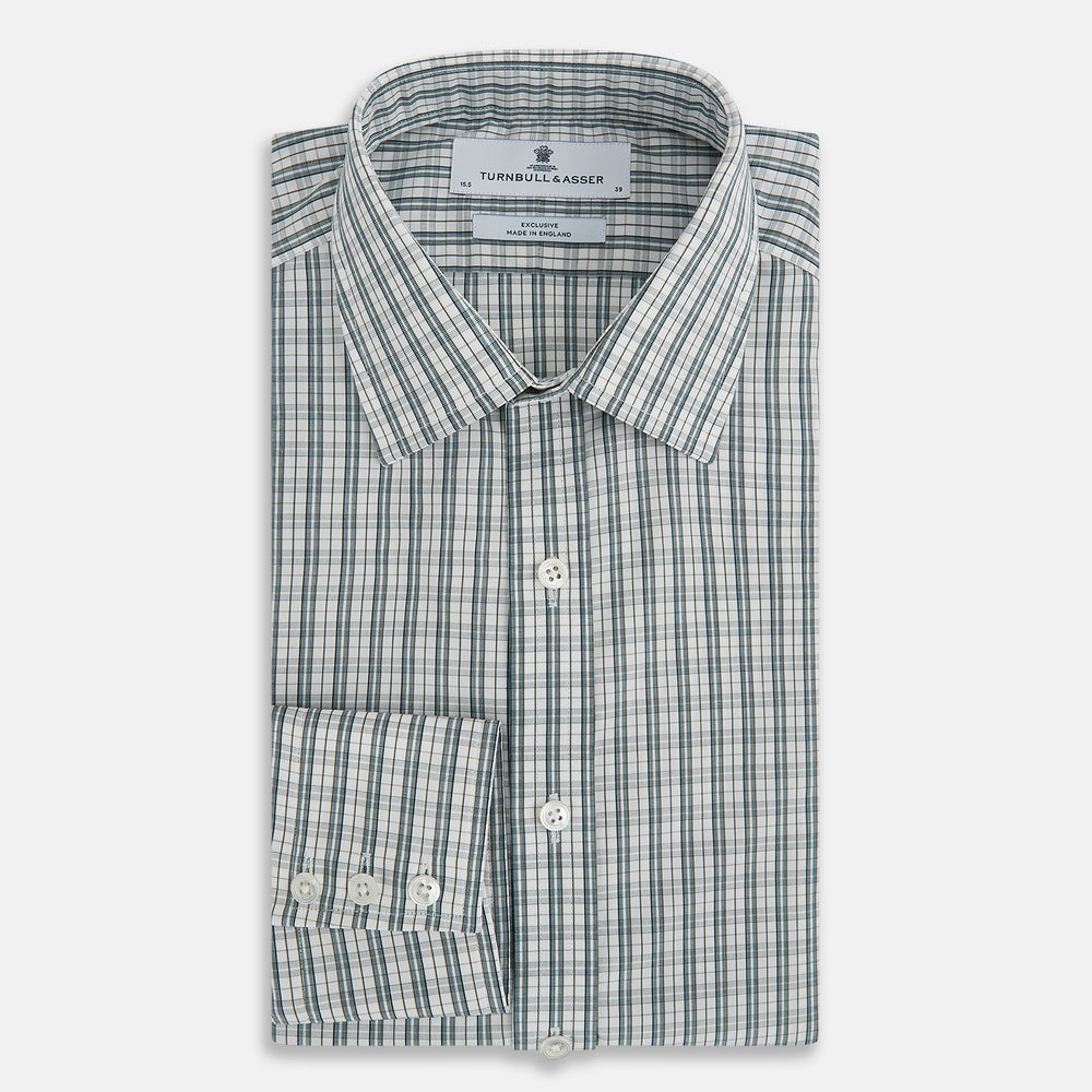The Turnbull & Asser Forest Green Multi Check Mayfair Shirt is a long-sleeve button-up crafted from premium Italian cotton, featuring a blue and forest green check on white, with a pointed collar and buttoned cuffs.
