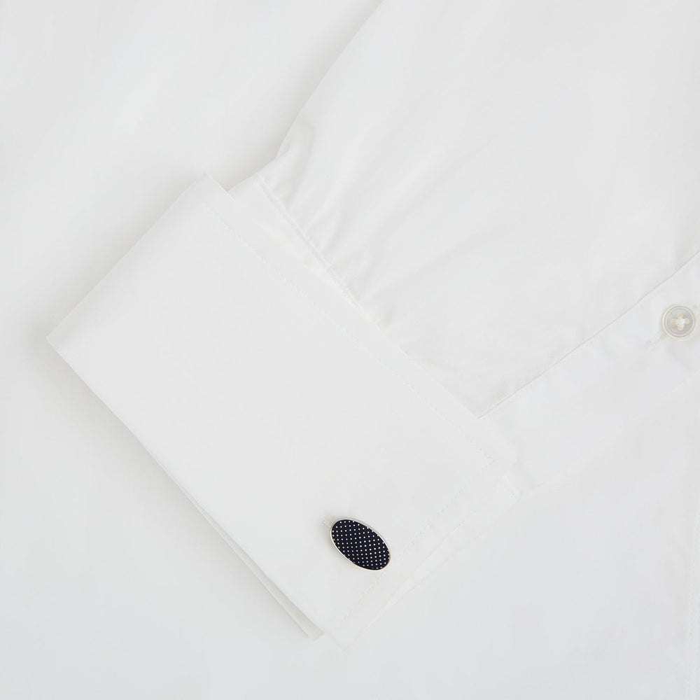 Turnbull & Asser's Navy Dotted Oval Cufflinks feature a silver finish and small white dots—ideal for adding a refined touch to any formal outfit. Shown here against a white background.