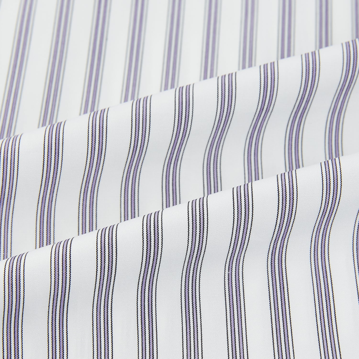 View 6 of product The Purple Multi Stripe Mayfair Shirt from Turnbull & Asser is a pure cotton, collared long-sleeve shirt with white and gray vertical stripes and buttoned cuffs, displayed flat on a white background.