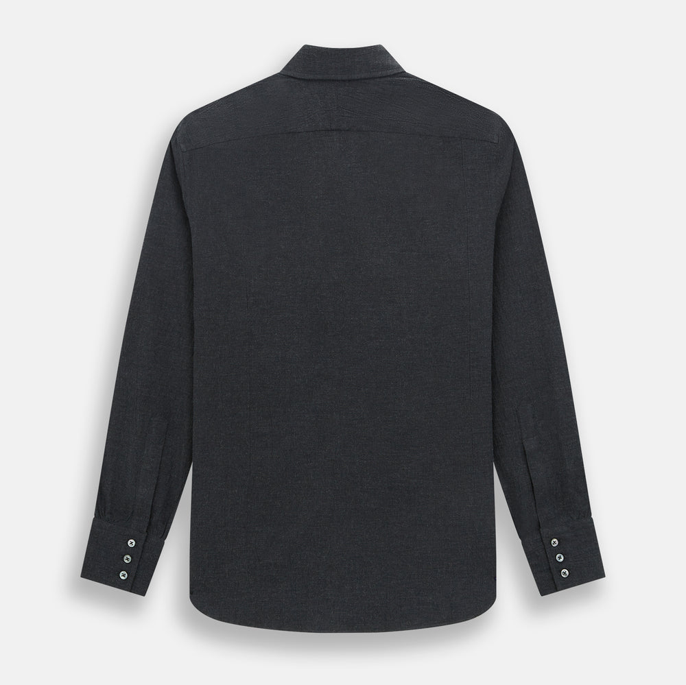 The Turnbull & Asser Midnight Blue Westminster Shirt features long sleeves, a button-up front, classic collar, and buttoned cuffs in a plain design—showcasing British craftsmanship—laid flat on a white background.