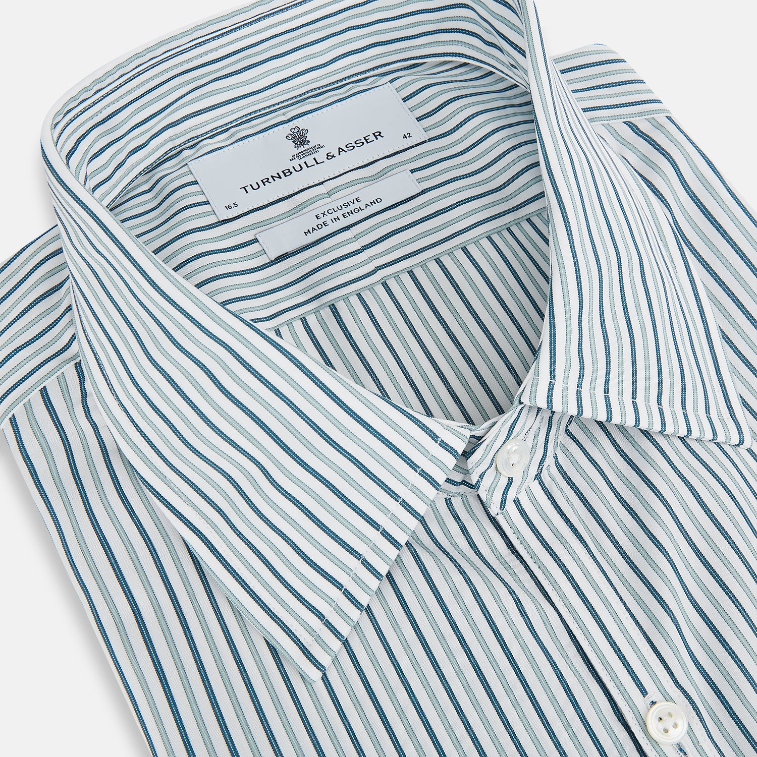 View 2 of product The GREEN DOUBLE STRIPE WESTMINSTER SHIRT by Turnbull & Asser features green and white vertical stripes, a pointed collar, buttoned cuffs, and a relaxed fit that highlights refined British craftsmanship.