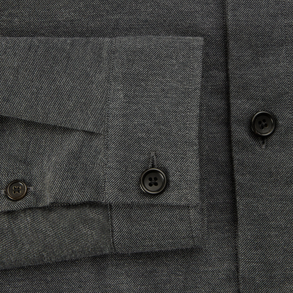The Charcoal Melange Hampstead overshirt by Turnbull & Asser is a dark gray long-sleeve button-up with a collar, left chest pocket, and two zippered side pockets, shown laid flat on a white background.