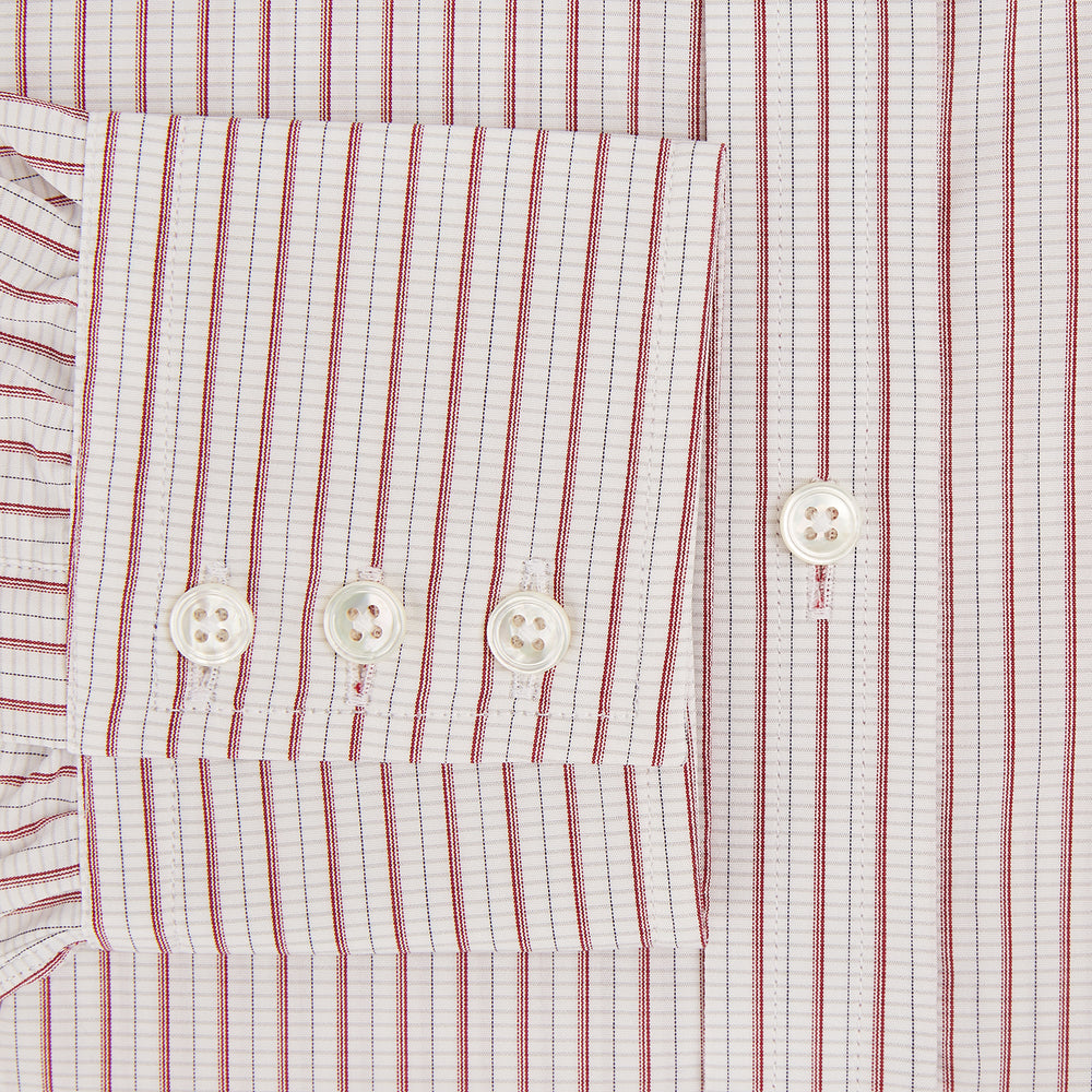 The Turnbull & Asser Red Graph Check Mayfair Shirt features a classic collar and buttoned cuffs, with red and blue stripes on white, ideal for formal wear. Laid flat on a white surface.