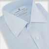 View 2 of product The Turnbull & Asser PALE BLUE COTTON REGULAR FIT MAYFAIR SHIRT is a long-sleeve, button-down shirt with a pointed T&A collar, shown laid flat on a white background.