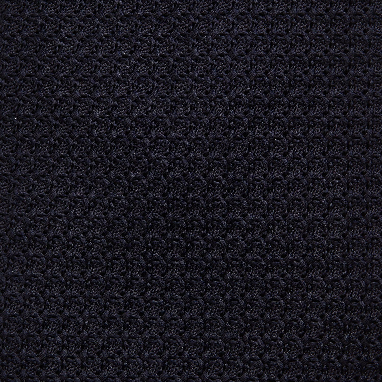 View 3 of product The Turnbull & Asser Midnight Blue Knitted Tie, elegantly textured and displayed on a white background, is a versatile addition to any gentleman's wardrobe.