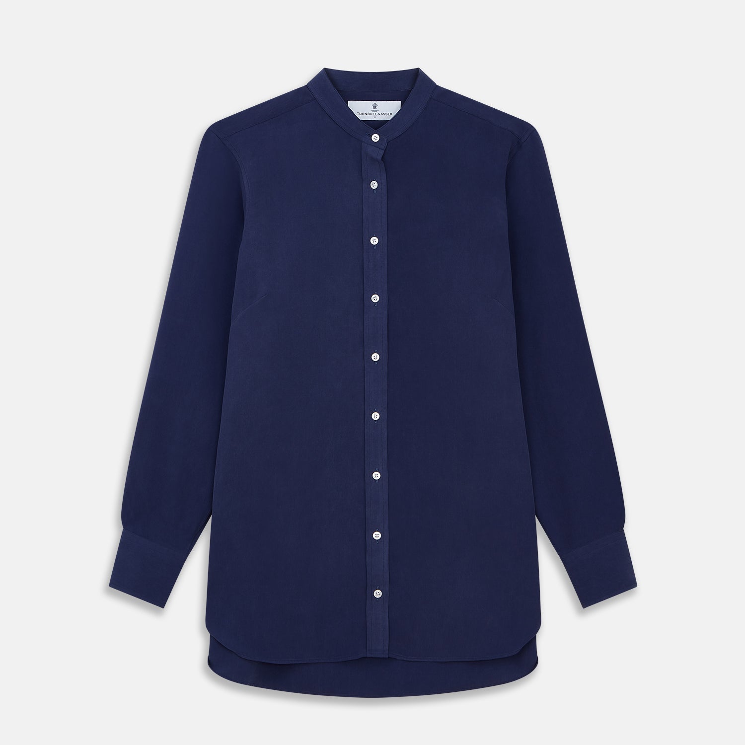 View 1 of product The Turnbull & Asser Blue Soft-touch Silk Lauren Shirt is a navy, long-sleeve button-up with an Igret stand collar, white buttons, curved hem, relaxed fit, and elongated body for a modern look, shown laid flat on a white background.