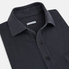 View 2 of product The Turnbull & Asser Charcoal Polo Shirt is a short-sleeve, soft cotton jersey top with a collar, three-button placket, and a left chest pocket, shown on a plain white background.