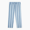 View 5 of product Turnbull & Asser's Blue Multi Stripe Pyjama Trousers feature light blue cotton with a blue multi-stripe pattern, an elastic waistband, and front drawstring, shown laid flat on a white background.