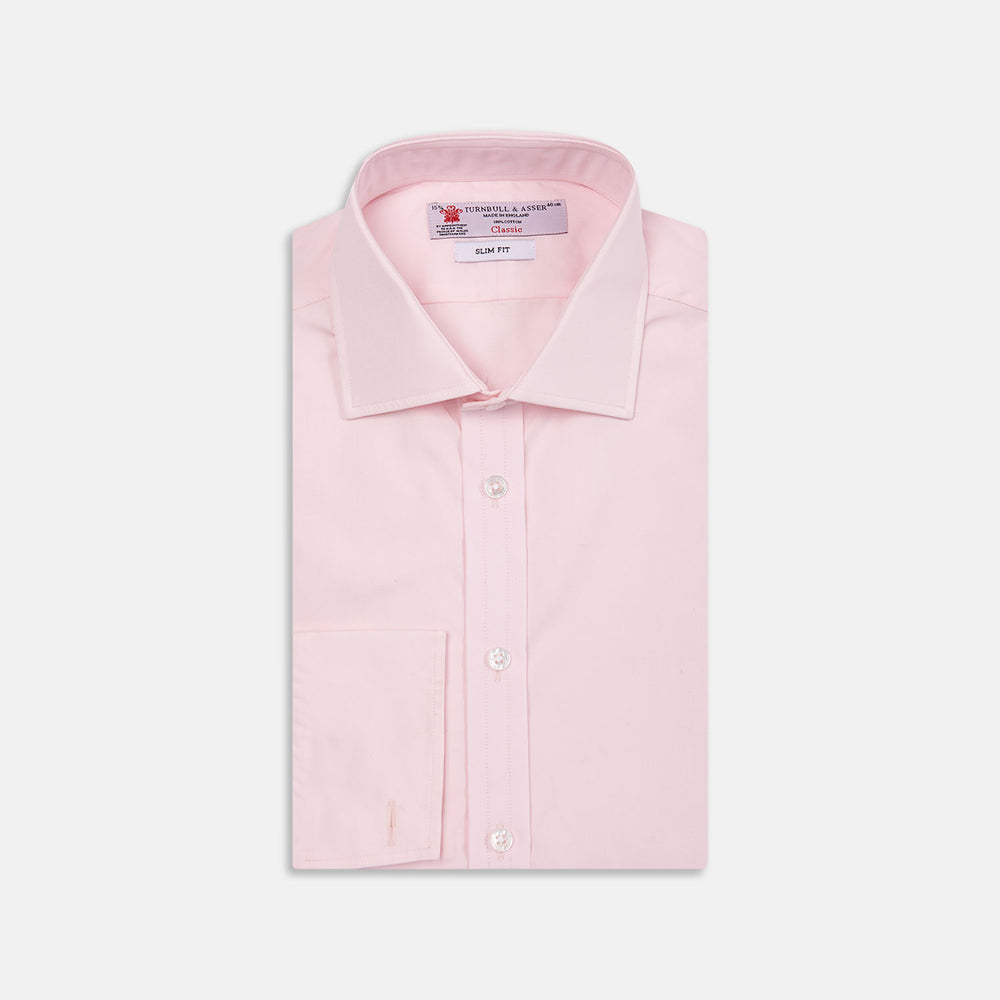 The Turnbull & Asser Pink Poplin Slim Fit Regent Collar Shirt features white buttons and a slim fit label, neatly folded and displayed on a plain white background.