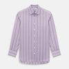View 1 of product The Turnbull & Asser Lilac Track Stripe Mayfair Shirt is a long-sleeve Italian cotton shirt in light purple with dark lilac vertical stripes, shown laid flat on a white background.