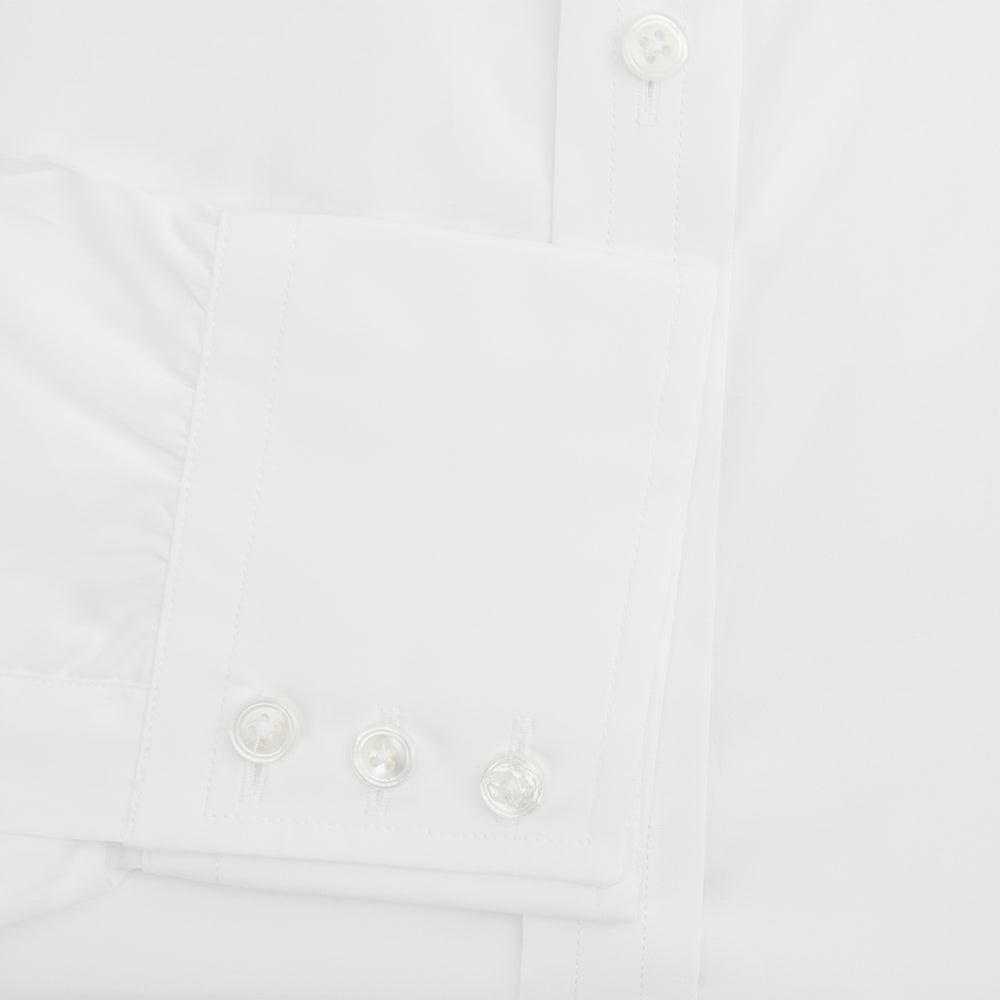 The Turnbull & Asser White West Indian Sea Island Cotton Shirt features a T&A collar, 3-button cuffs, and is crafted from luxurious long-staple cotton for exceptional softness. Displayed against a white background.