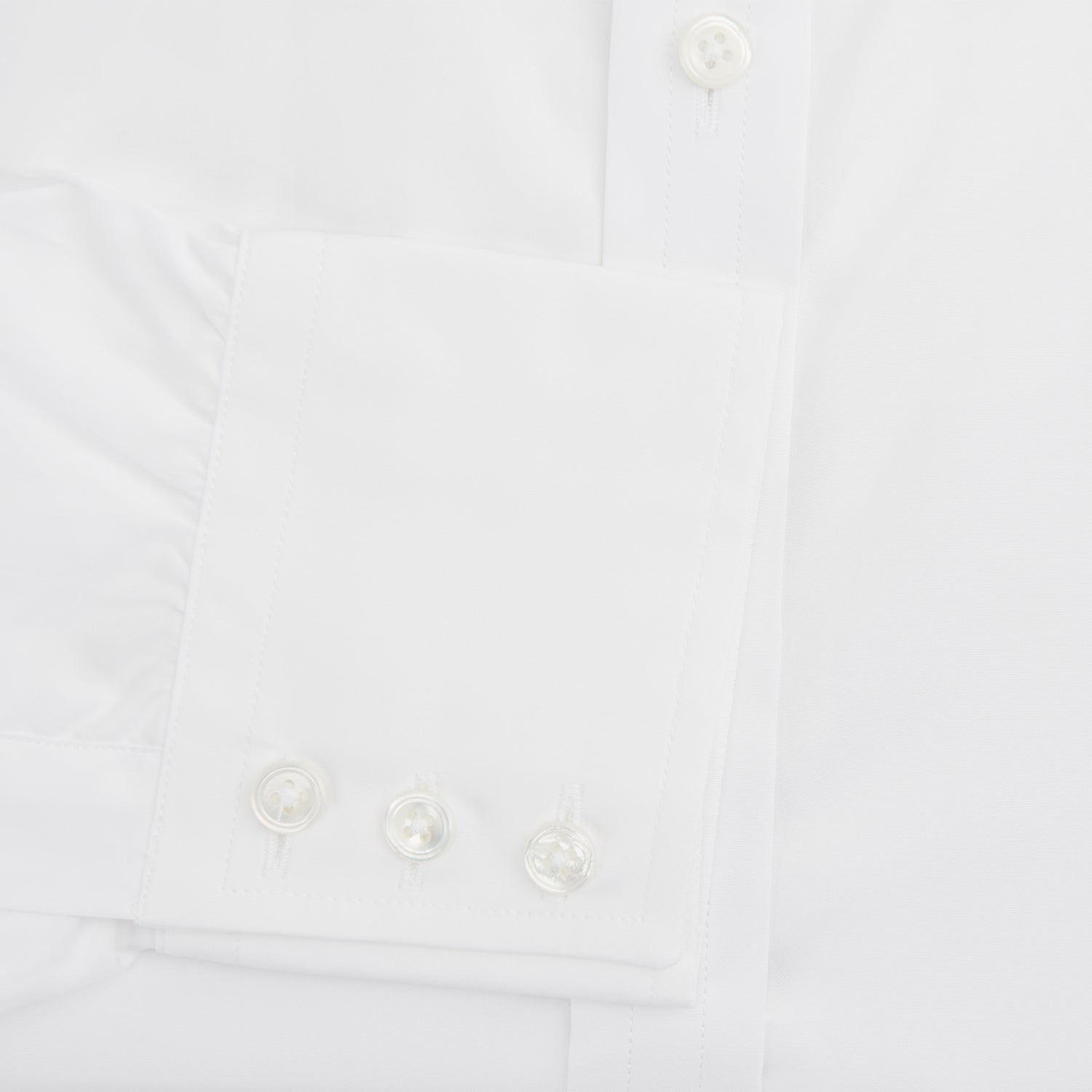 View 3 of product The Turnbull & Asser White West Indian Sea Island Cotton Shirt features a T&A collar, 3-button cuffs, and is crafted from luxurious long-staple cotton for exceptional softness. Displayed against a white background.