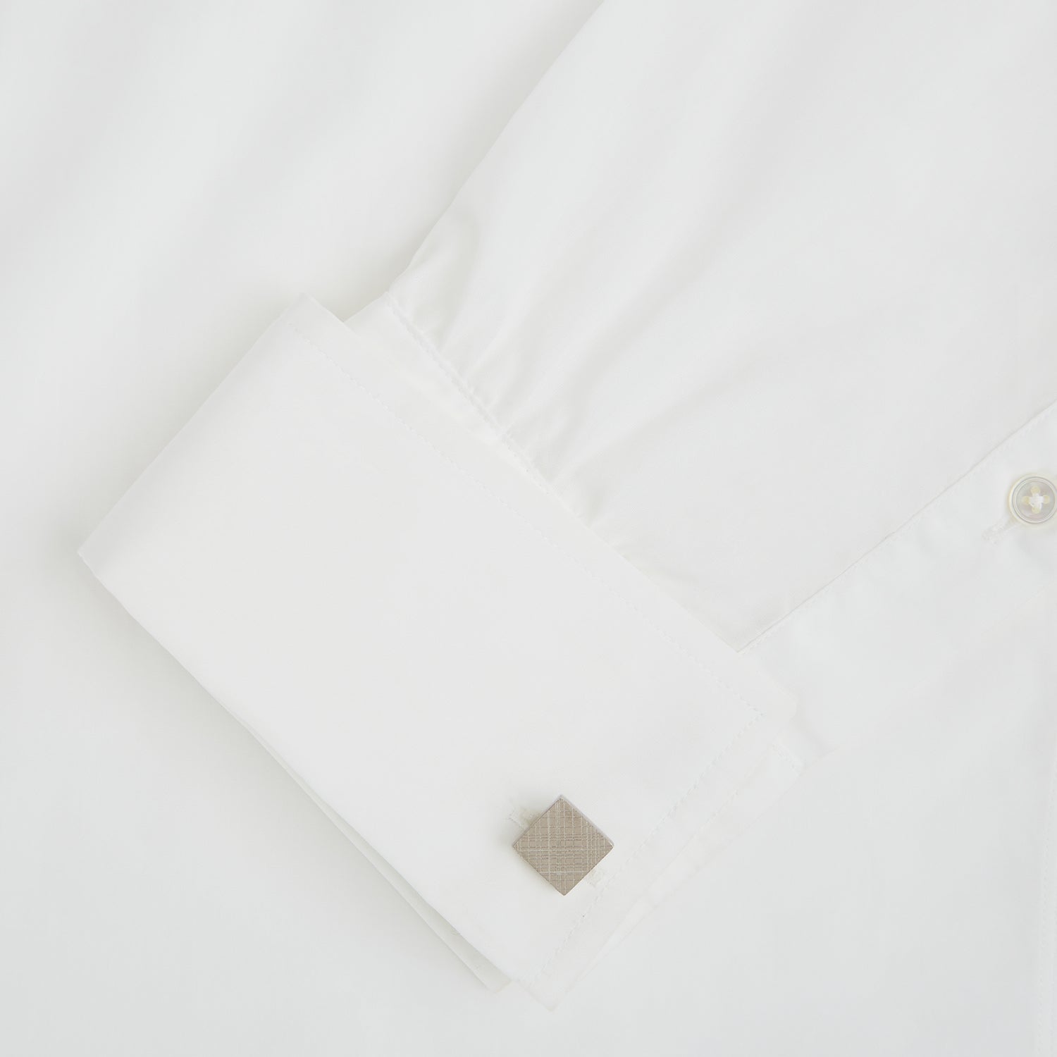 View 3 of product Turnbull & Assers Silver Grid Square Cufflinks feature a geometric crisscross pattern, offering refined elegance and displayed against a white background.