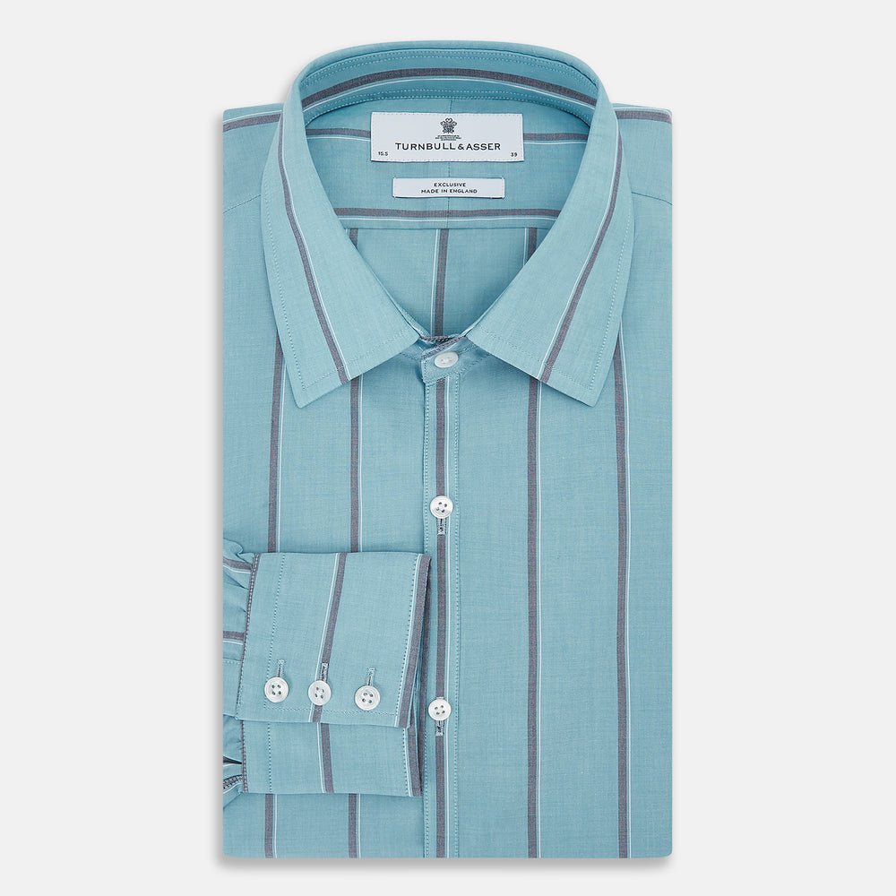 The Cendre Blue Track Stripe Westminster Shirt by Turnbull & Asser features a light blue hue, dark vertical stripes, button-down front, classic collar, and buttoned cuffs—showcasing British craftsmanship.