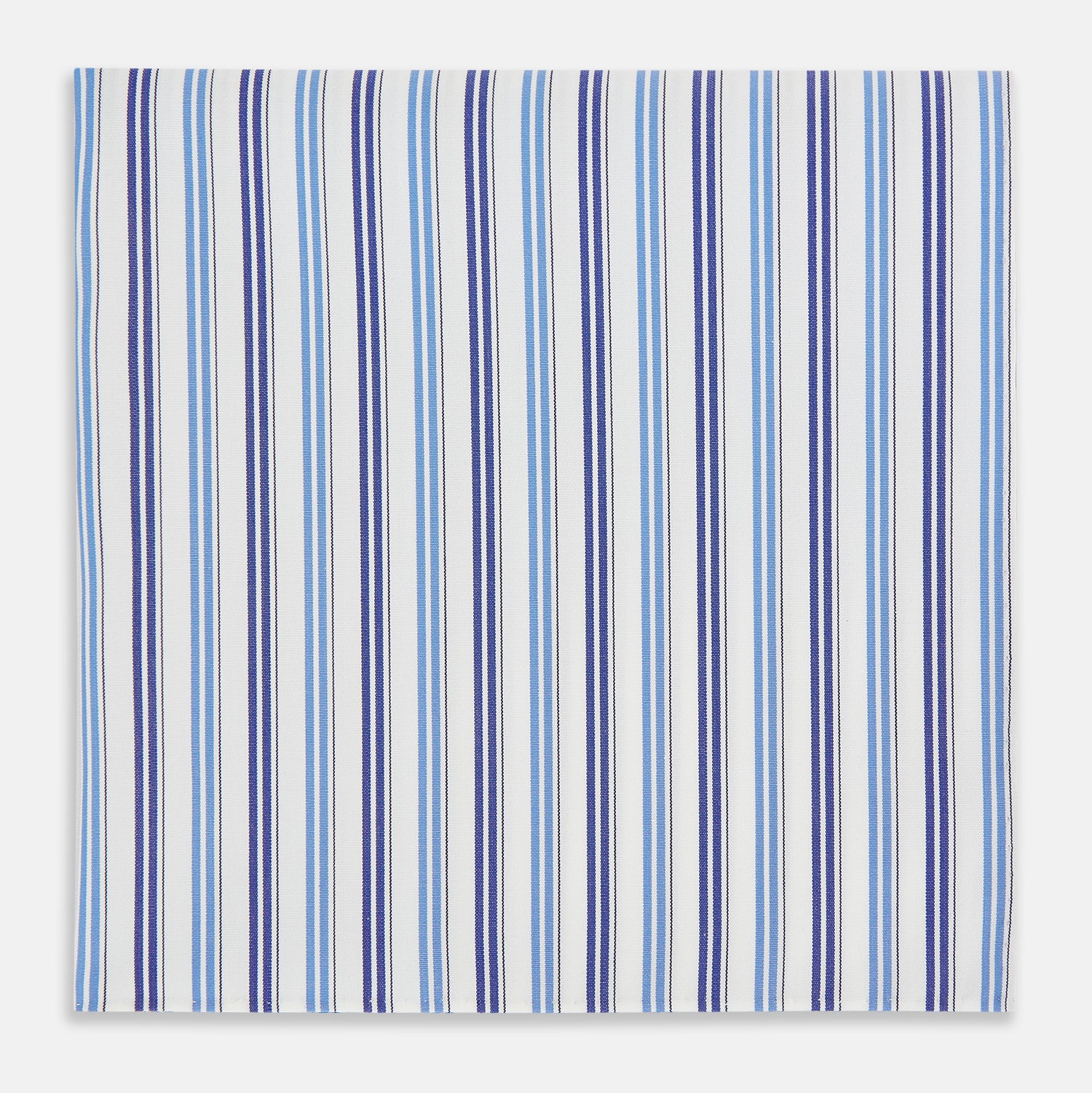 View 1 of product The Blue and Navy Multi Stripe Hand-Rolled Handkerchief by Turnbull & Asser is crafted in England with a white background and evenly spaced vertical stripes in blue and navy.