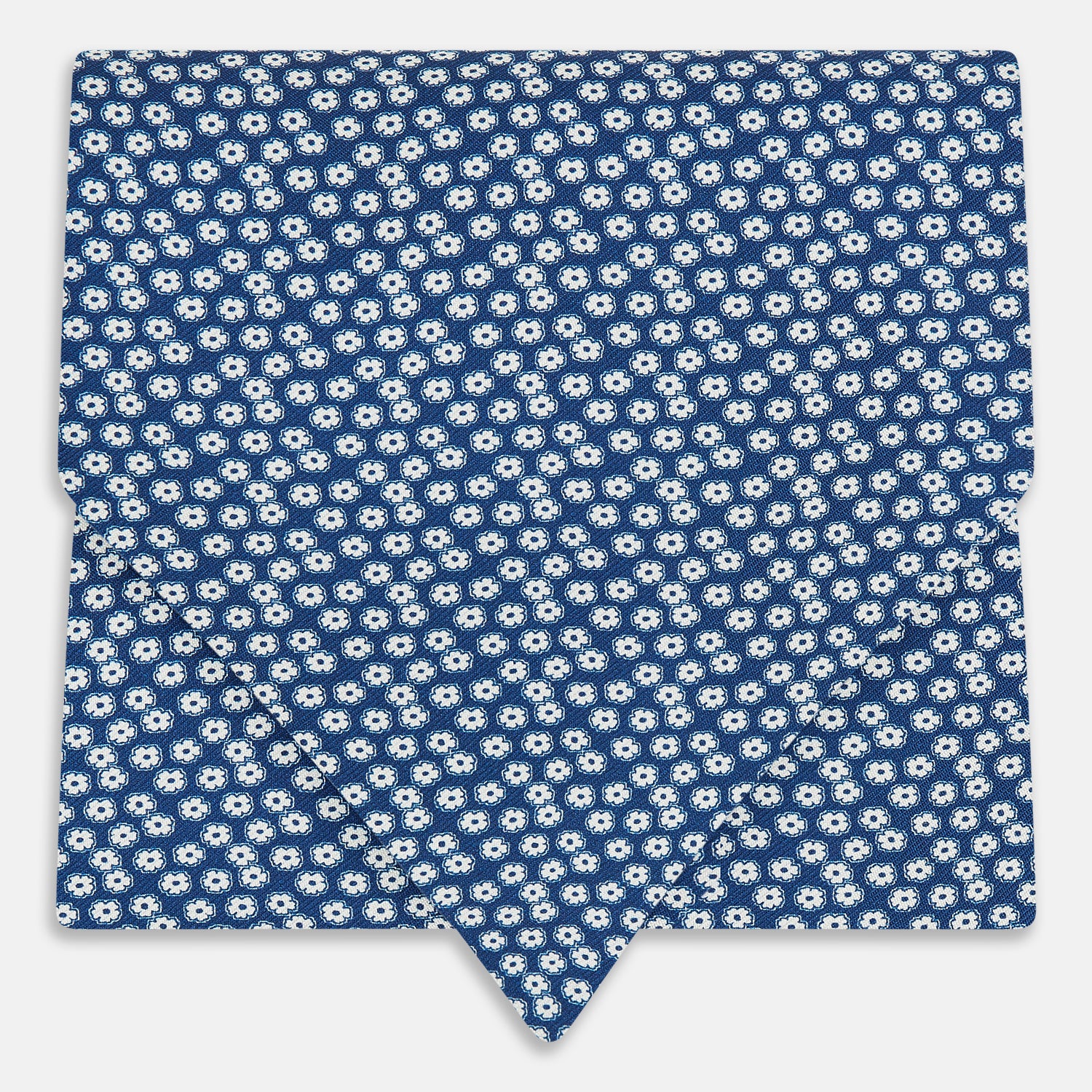 View 1 of product The Azzurro Flower Patterned Silk Cravat by Turnbull & Asser features a classic blue design with small white flowers—a refined British-inspired accessory.