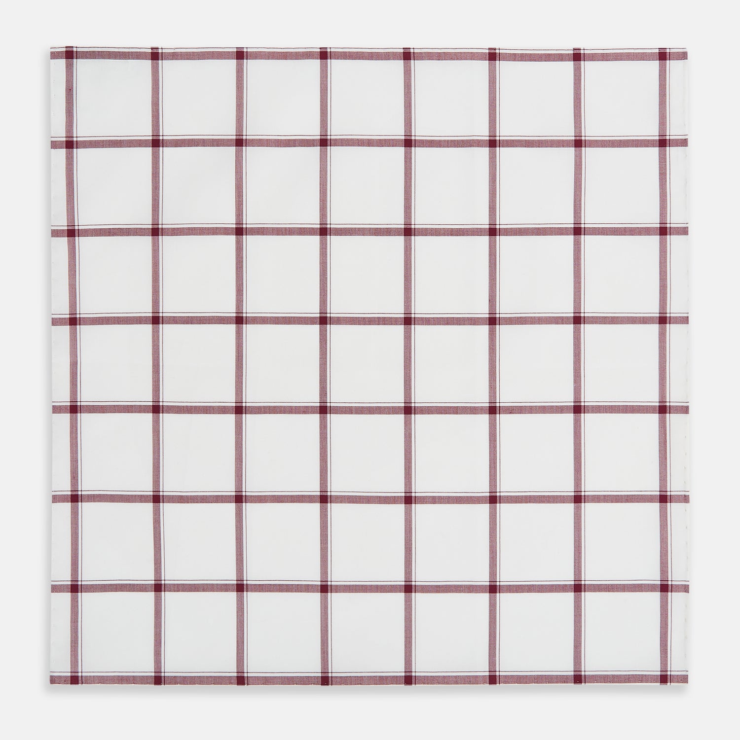View 3 of product The Turnbull & Asser Burgundy Grid Check Hand-Rolled Handkerchief features a white base with burgundy grid lines forming large squares and is finished with elegant hand-rolled edges.