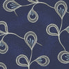 View 4 of product The Turnbull & Asser Navy Jacquard Silk Floral Tie features white and light blue abstract leaf designs, exemplifying fine British craftsmanship. Shown rolled up against a white background.
