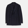 View 1 of product The Turnbull & Asser Navy Wool Pinstripe Double-Breasted Jacket features peak lapels, four front buttons, and three front pockets, and is displayed on a plain white background.
