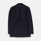 The Turnbull & Asser Navy Wool Pinstripe Double-Breasted Jacket features peak lapels, four front buttons, and three front pockets, and is displayed on a plain white background.